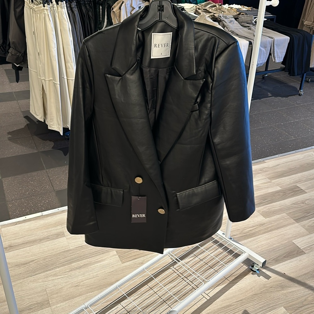 Leather jacket with gold buttons